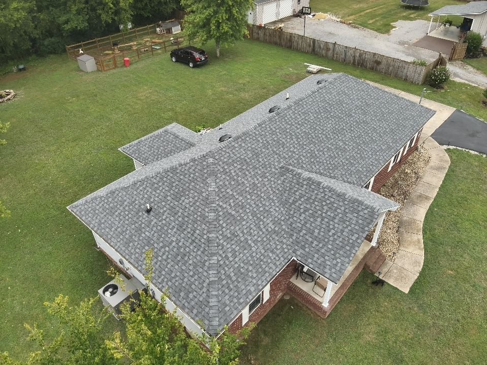Completed shingle roof — brick home
